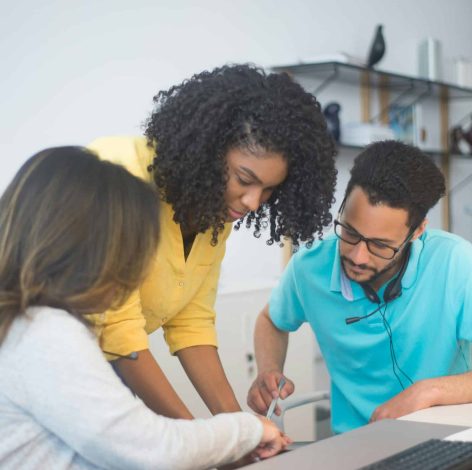 Dynamic teamwork in a bright, modern workspace fosters creativity and collaboration among engaged colleagues.